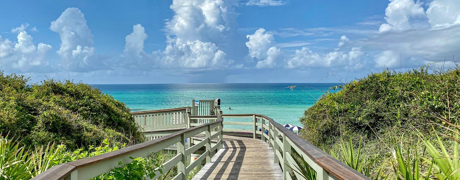 boardwalk leading down to the beach and turquoise water